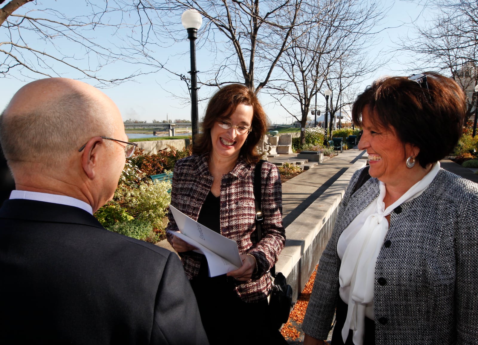 Julia Wallace, Cox Media Group Ohio market vice president, shows the $1 million check from the James M. Cox Foundation to Dr. Mike Ervin, co-chair of the Greater Downtown Dayton Plan, and Sandy Gudorf, Downtown Dayton Partnership president, before an announcement that the RiverScape River Run project reached its fundraising goal of $4 million. STAFF PHOTO BY CHRIS STEWART