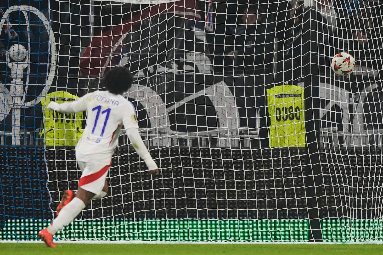 Lyon's Malick Fofana scores his side' second goal during the Europa League soccer match between Lyon and Eintracht Frankfurt at Decines stadium outside Lyon, France, Thursday, Dec. 12, 2024. (AP Photo/Michel Euler)