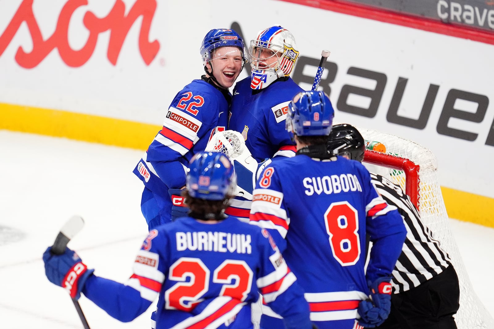 United States forward Max Plante (22) celebrates with teammate Trey Augustine (1) after they defeated Czechia in World Junior hockey championship semifinal game action in Ottawa, Ontario, Saturday, Jan. 4, 2025. (Sean Kilpatrick/The Canadian Press via AP)