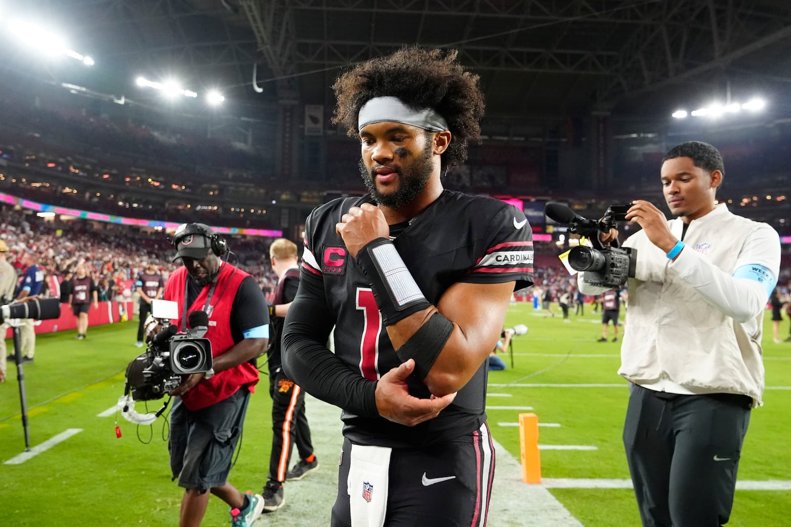 Arizona Cardinals quarterback Kyler Murray walks off the field after an NFL football game against the Los Angeles Chargers, Monday, Oct. 21, 2024, in Glendale Ariz. (AP Photo/Ross D. Franklin)