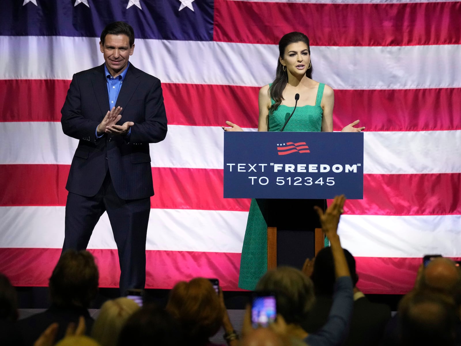 FILE - Florida Gov. Ron DeSantis, left, looks on as his wife Casey DeSantis speaks at the final of three presidential campaign stops in South Carolina on Friday, June 2, 2023, in Greenville, S.C. (AP Photo/Meg Kinnard, File)