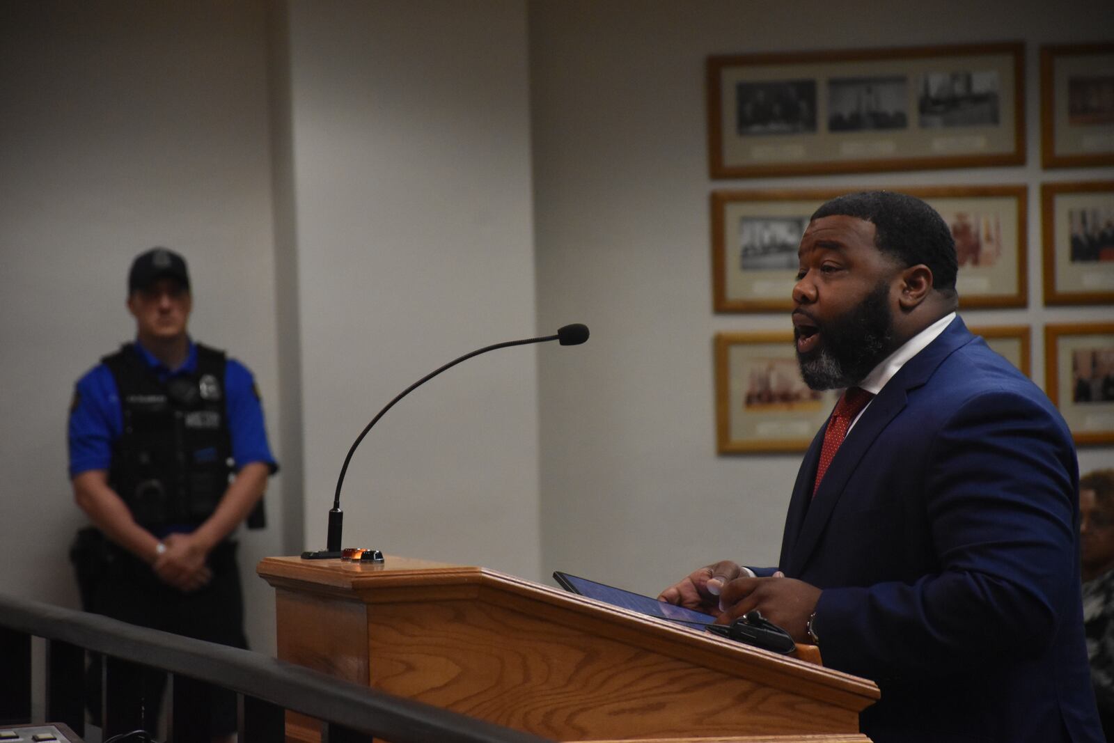 Joshua Ward, senior pastor at Omega Baptist Church in northwest Dayton, speaks about the death of 16-year-old Brian Moody at the Dayton City Commission meeting on July 3, 2024. Moody was fatally shot by police on June 29. CORNELIUS FROLIK / STAFF