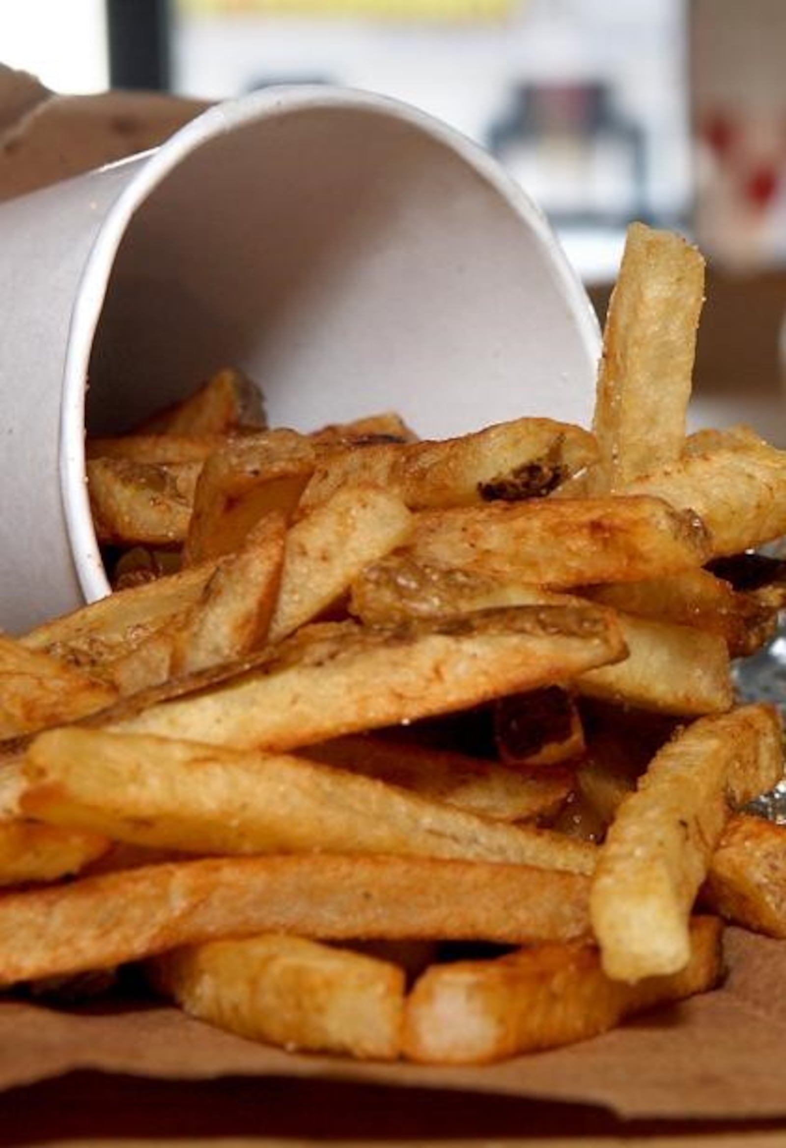 The burger chain has freshly made boardwalk-style fries that customers can dress up with Cajun spices for a little kick. GREG LYNCH/STAFF