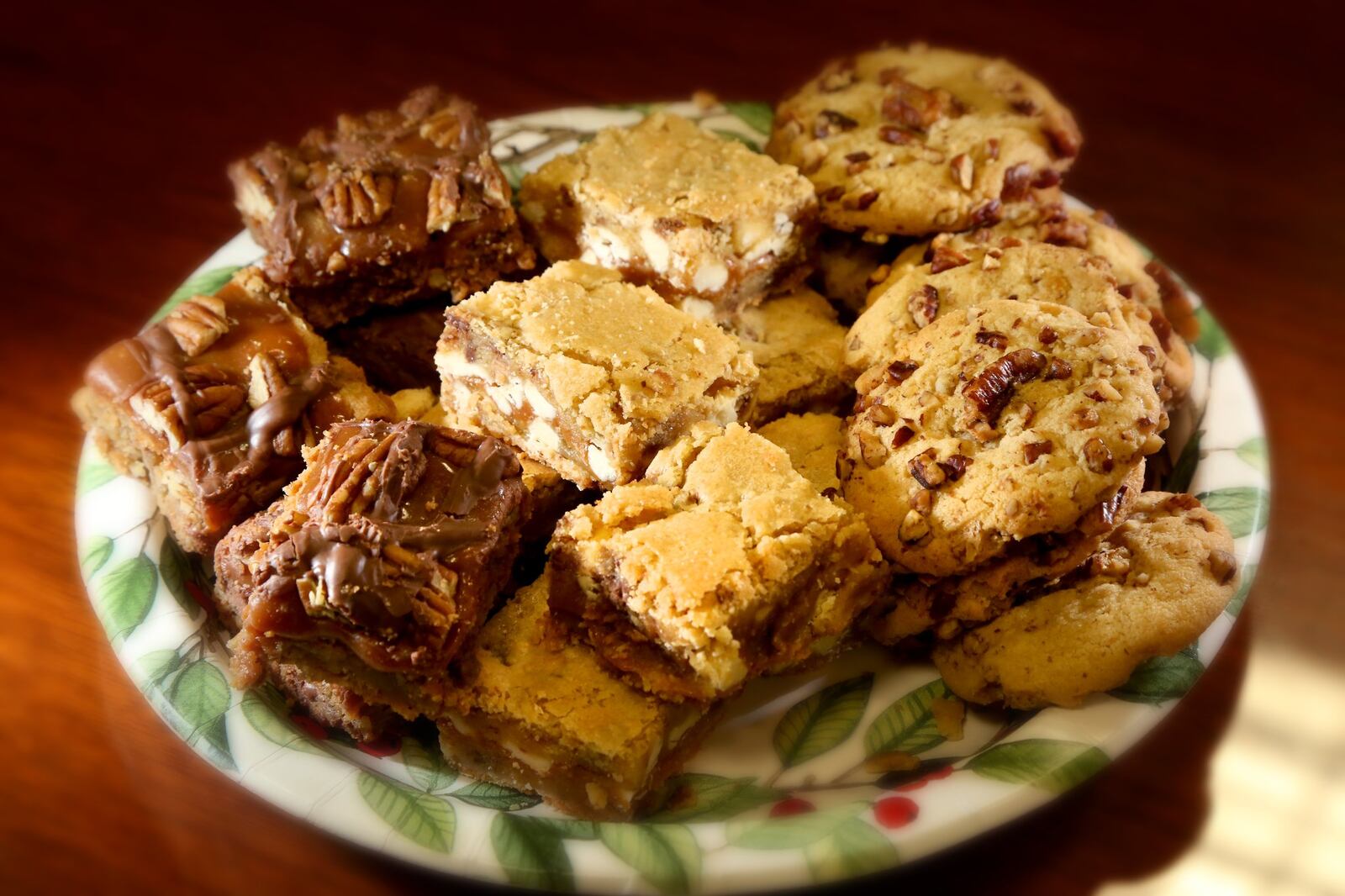 The top three prize winners in the 2018 Dayton Daily News Cookie Contest. In the center row is the first-place winner, White Chocolate Caramel Toffee Blondies. At left is the second place winner, Chocolate Chip Turtle Cookie Bars and at right is the third-place winner, Butter Pecan Cookies. LISA POWELL / STAFF