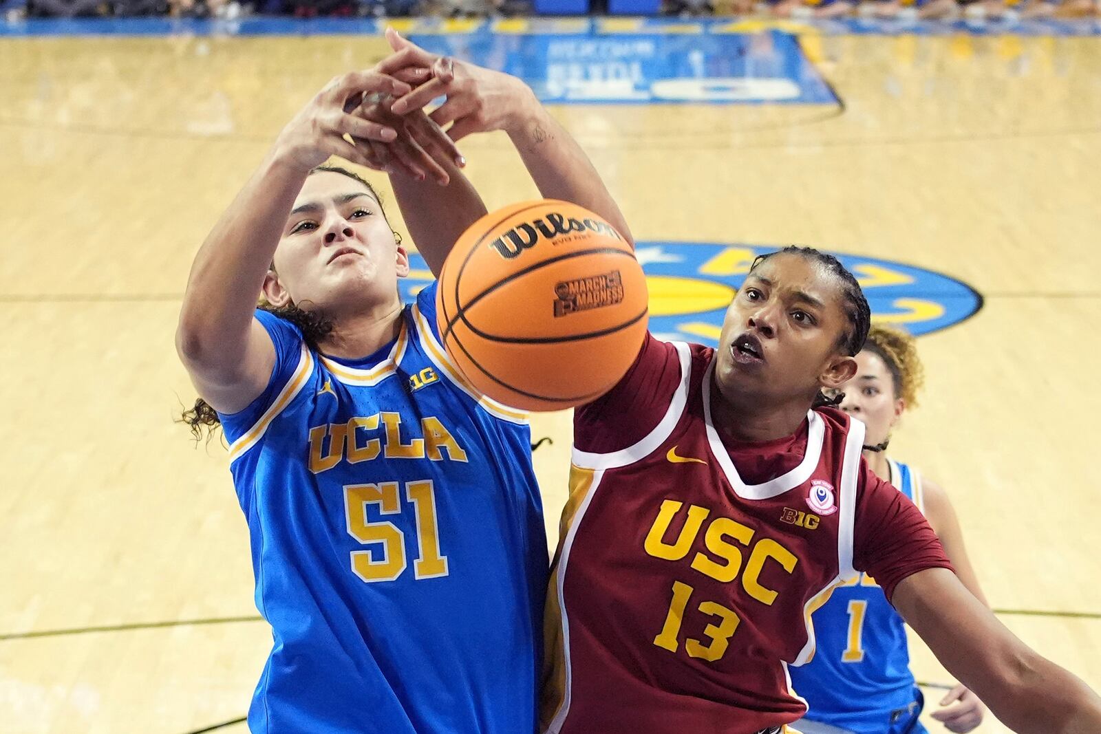 UCLA center Lauren Betts, left, and Southern California center Rayah Marshall go after a rebound during the second half of an NCAA college basketball game Saturday, March 1, 2025, in Los Angeles. (AP Photo/Mark J. Terrill)