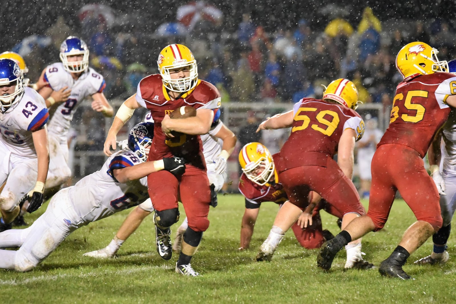 Fenwick’s Jack Fessler cuts through the Clinton-Massie defense during last Friday night’s game at Krusling Field in Middletown. C-M held on for a 21-18 victory. CONTRIBUTED PHOTO BY ANGIE MOHRHAUS