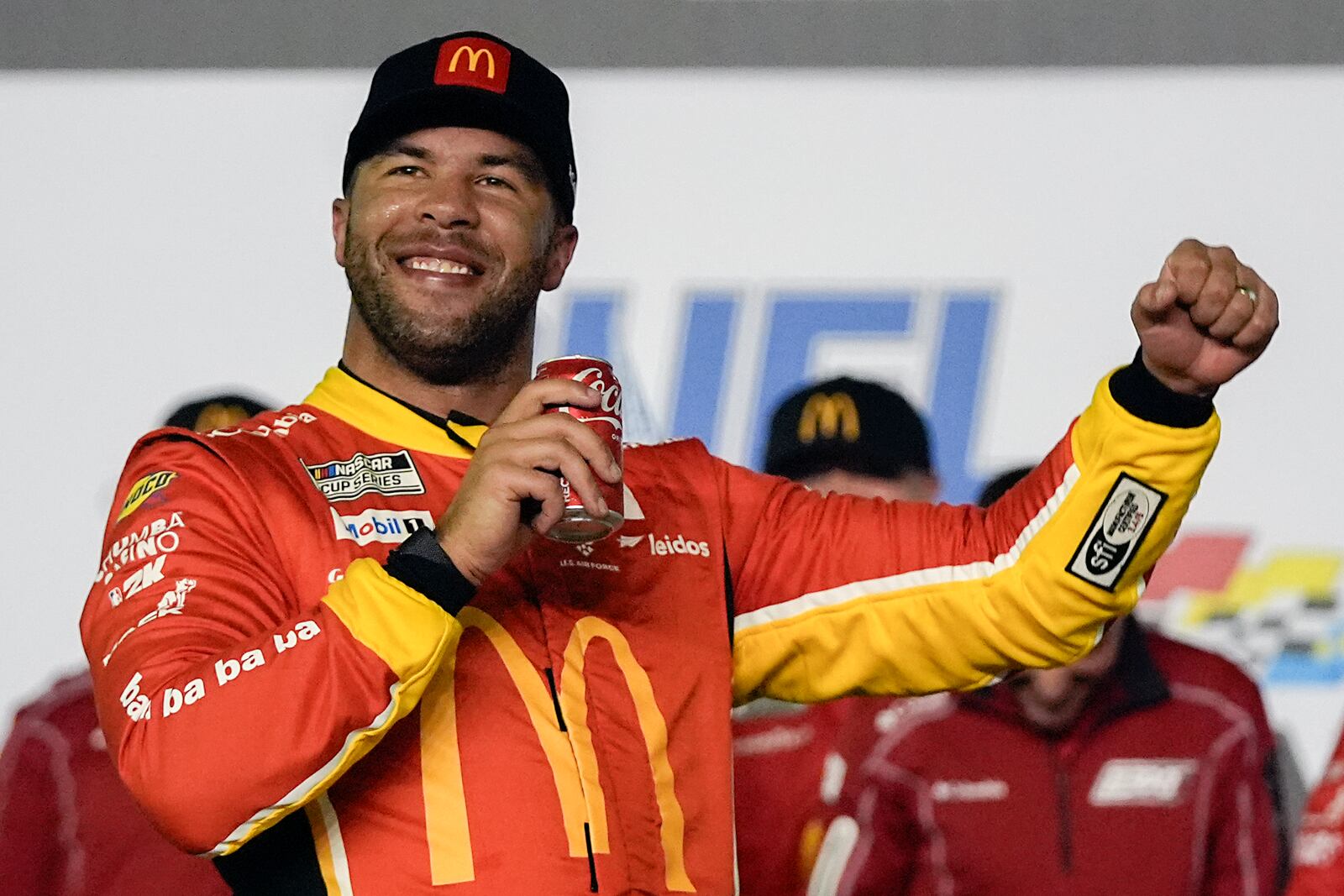 Bubba Wallace celebrates in Victory Lane after winning the first of two NASCAR Daytona 500 qualifying auto races at Daytona International Speedway, Thursday, Feb. 13, 2025, in Daytona Beach, Fla. (AP Photo/John Raoux)