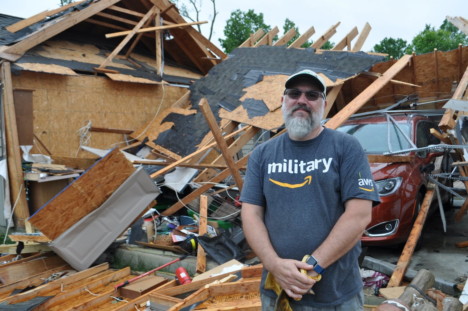 Mike Roberts of Charlie Court in Brookville stands in front of his garage that was destroyed by a tornado. He and other family members scrambled to the basement when they heard the winds blowing. “We were pretty lucky in this whole thing … the garage is just a garage. It can be replaced.” MAX FILBY/STAFF