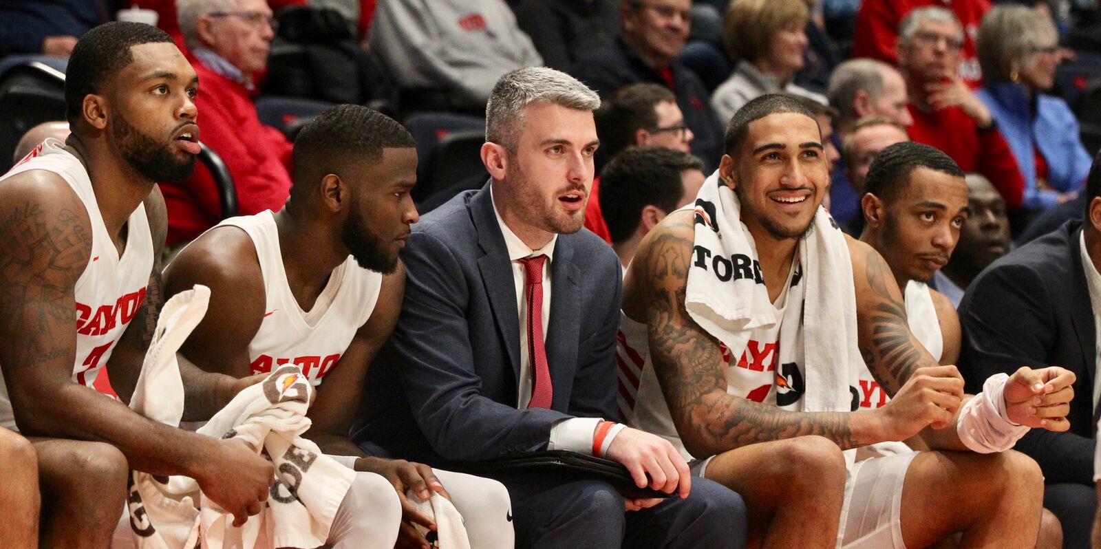 Dayton's Obi Toppin, second from right, sits on the bench during an exhibition game against Cedarville on Saturday, Nov. 2, 2019 at UD Arena. Also pictured are (left to right): Trey Landers, Jalen Crutcher, Brett Comer and, far right, Rodney Chatman.