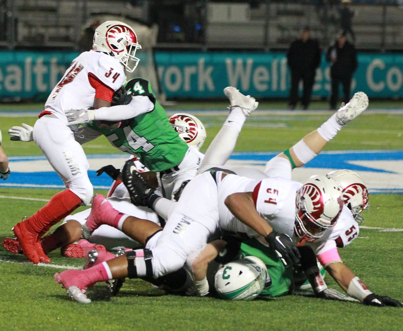 Hezekiah Hudson-Davis of Trotwood (with ball) is met by Evan Schlensker of Badin. Trotwood-Madison defeated Badin 20-7 in a D-III, Region 12 high school football final at Miamisburg on Friday, Nov. 22, 2019. MARC PENDLETON / STAFF