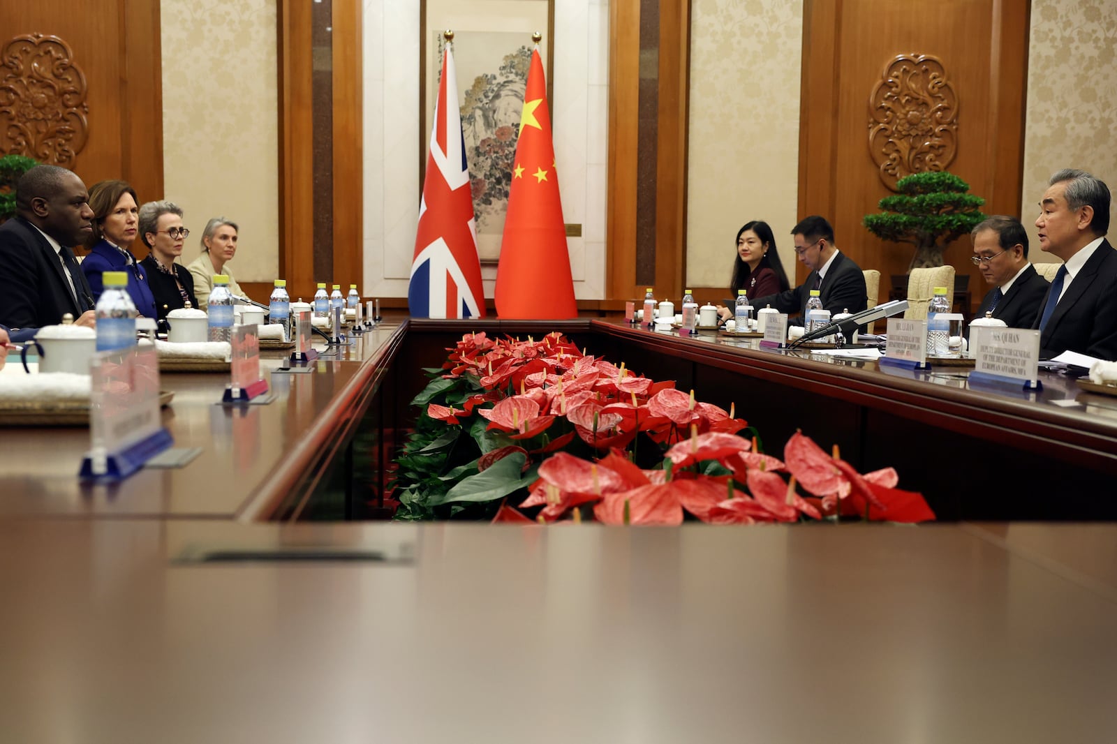 Britain's Foreign Secretary David Lammy, left, attends a meeting with Chinese Foreign Minister Wang Yi, right, at the Diaoyutai State Guesthouse in Beijing, China, Friday, Oct. 18, 2024. (Florence Lo/Pool Photo via AP)