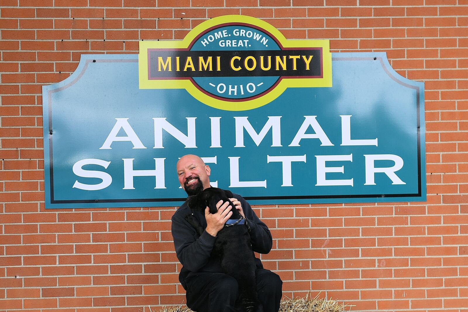 Rob Craft talks about changes at the Miami County Animal Shelter while accompanied by one of the dogs available for adoption. CONTRIBUTED