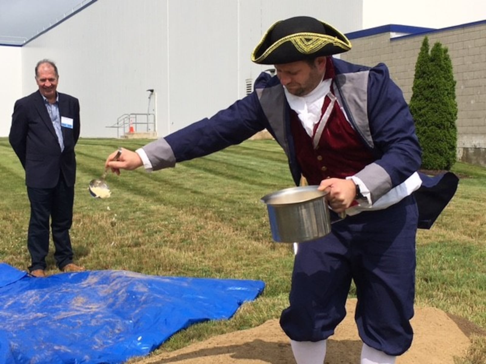 A White Castle "town crier" "christens" ground about to be broken for construction last July with grilled onions. The White Castle food plant in Vandalia will double in size. THOMAS GNAU/STAFF