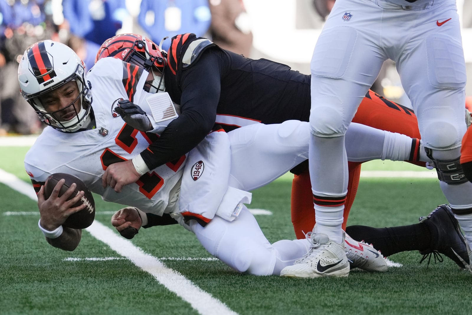 Cincinnati Bengals defensive end Trey Hendrickson (91) sacks Cleveland Browns quarterback Dorian Thompson-Robinson (17) during the first half of an NFL football game, Sunday, Dec. 22, 2024, in Cincinnati. (AP Photo/Joshua A. Bickel)