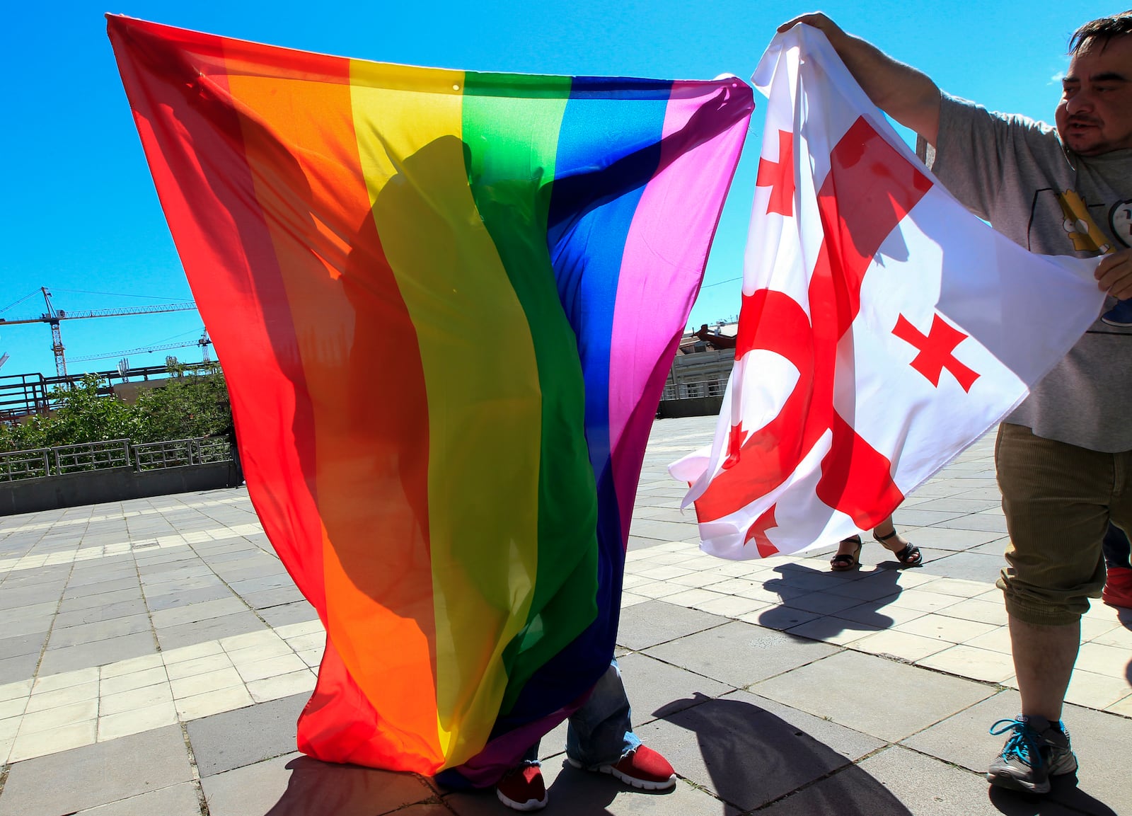 FILE - Georgian LGBTQ+ activists attend a rally against homophobia to mark the international day against homophobia, in downtown Tbilisi, Georgia, on May 17, 2017. (AP Photo/Shakh Aivazov, File)