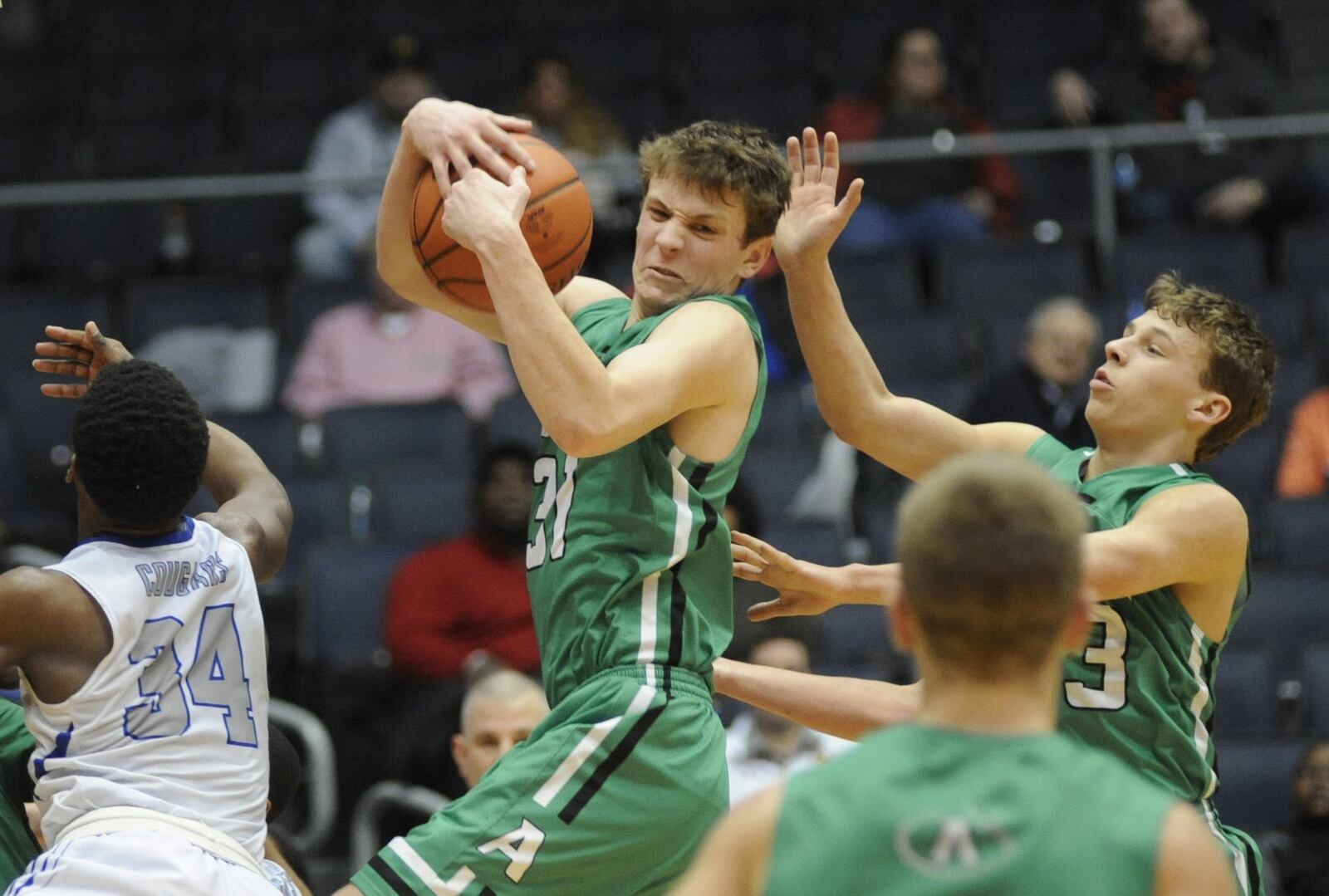 Carter Elliott of Anna secures a rebound. Anna defeated Cin. Clark Montessori 68-59 in a boys high school basketball D-III district final at UD Arena on Sunday, March 10, 2019. MARC PENDLETON / STAFF