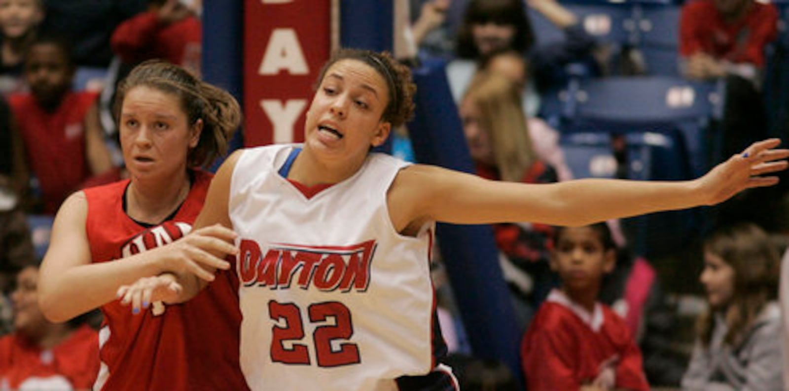 Casey Nance (22), of Dayton works for position in the low post as Stephanie Ford, of Miami, defends the low post. Dayton hosted the game and lost, in overtime, 69 to 66.