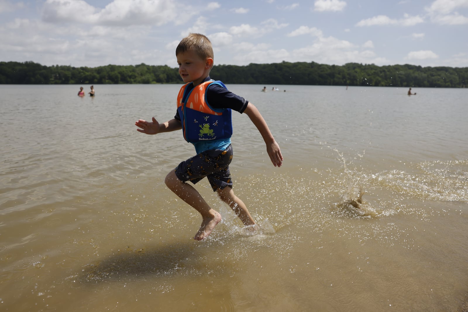 Weston Holt, 4, splashes in the water on the beach of Acton Lake at Hueston Woods State Park Thursday, June 16, 2022. NICK GRAHAM/STAFF