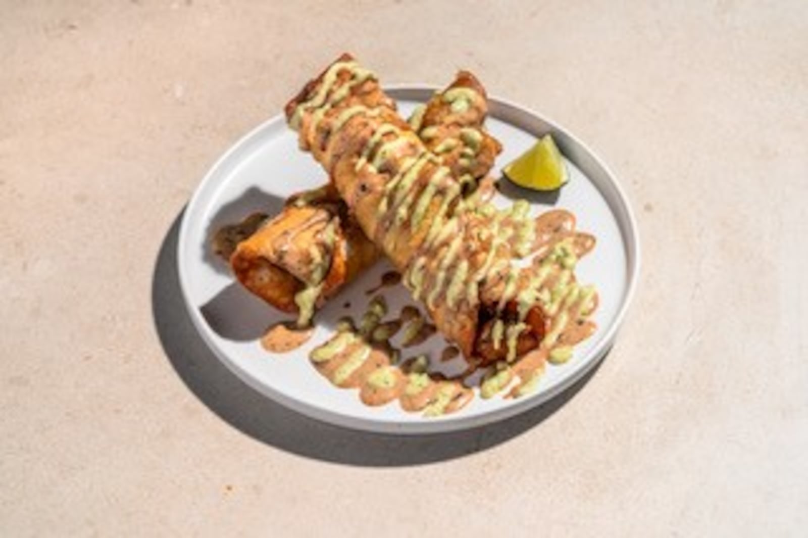 Pictured are the new chicken rolled tacos at Rusty Taco featuring grilled chicken, chipotle aioli, avocado crema and mozzarella cheese rolled up and fried (CONTRIBUTED PHOTO).