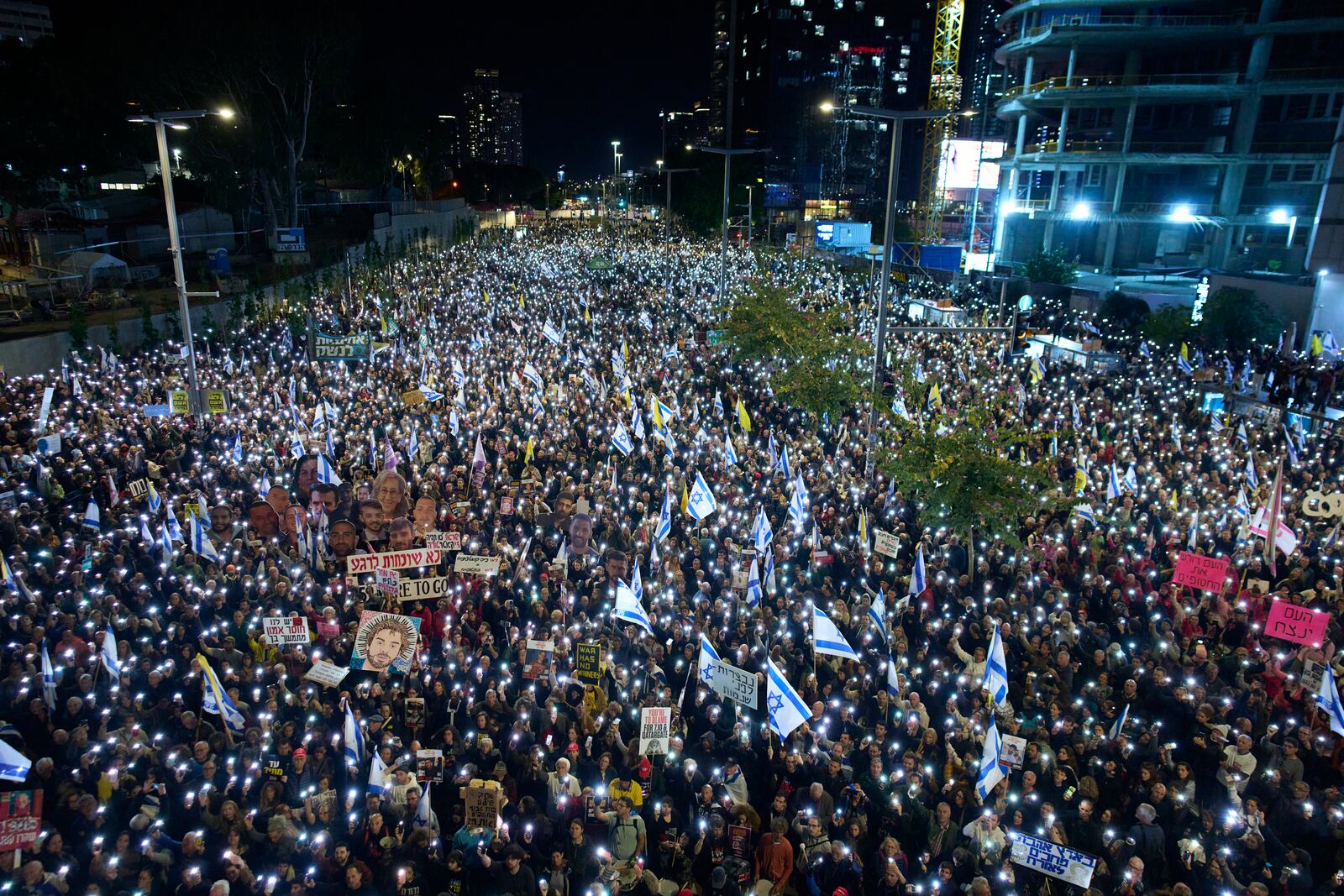 People take part in a protest demanding the immediate release of hostages held by Hamas in the Gaza Strip, in Tel Aviv, Israel, Saturday, March 22, 2025. (AP Photo/Ohad Zwigenberg)