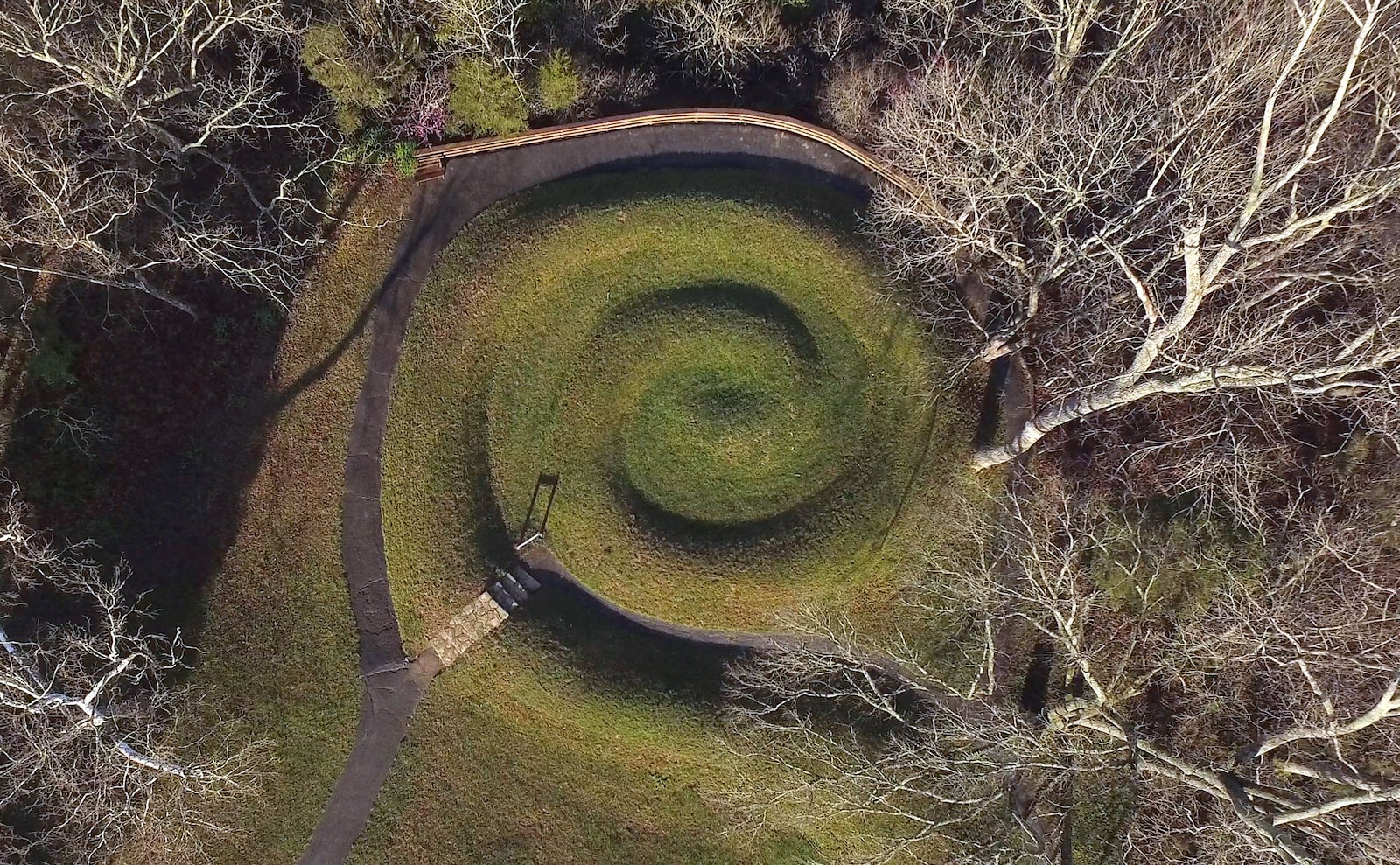 Serpent Mound's coiled tail has alignment with the summer solstice sunset.   Serpent Mound is the largest surviving ancient effigy mound in the world and is on the National Register of Historic Places.  It is located near Peebles, Ohio on State Route 73.    TY GREENLEES / STAFF