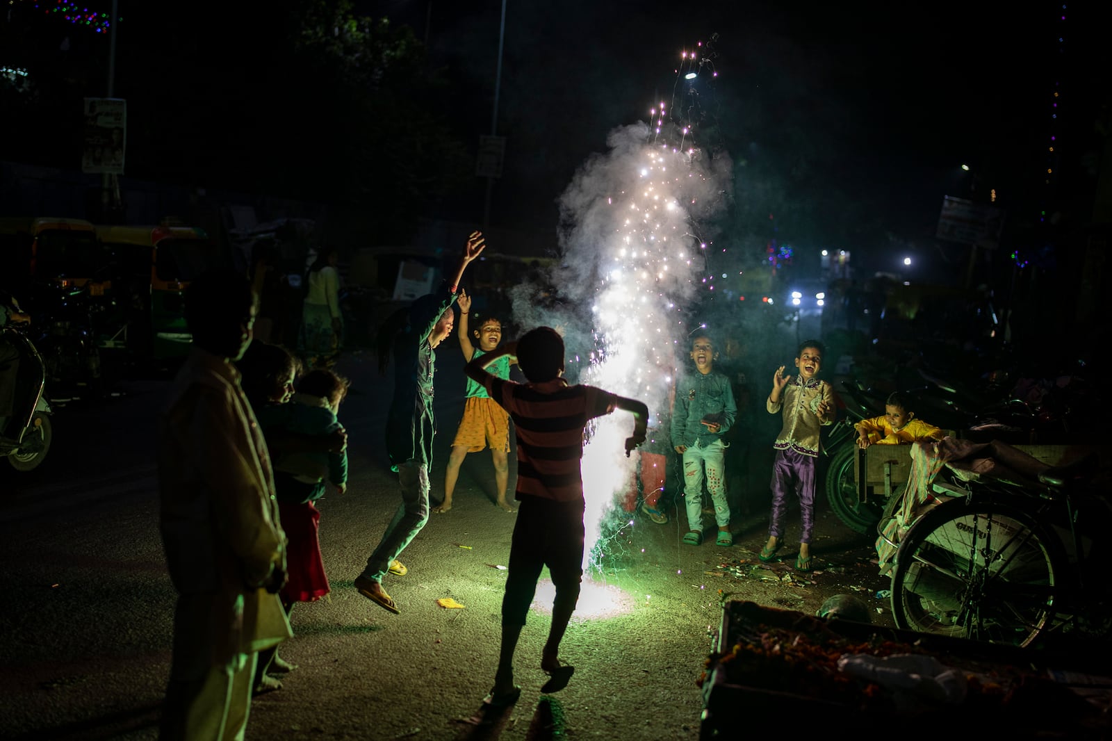 FILE- Children play with firecrackers during Diwali celebrations in New Delhi, India, Nov. 4, 2021. (AP Photo/Altaf Qadri, File)