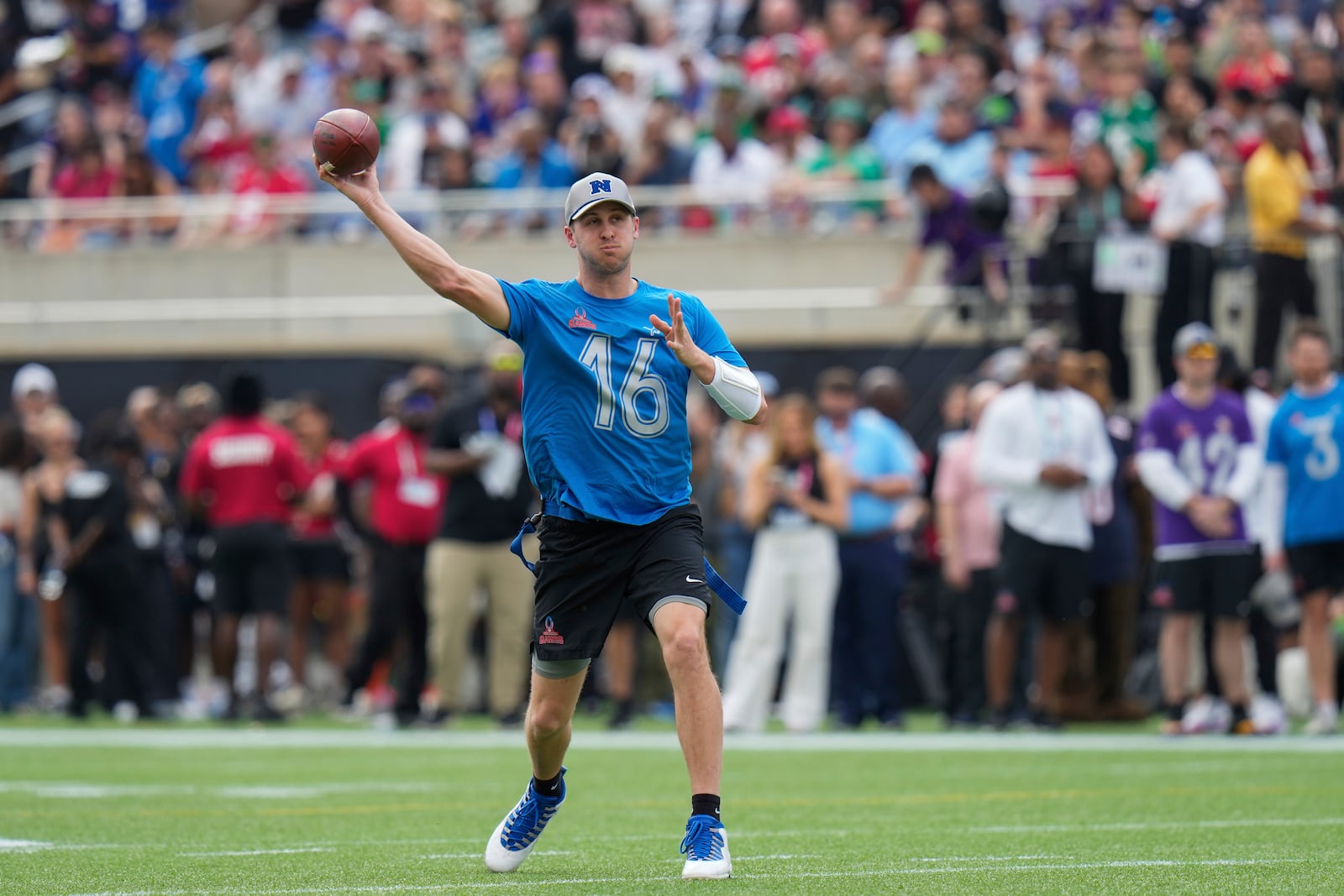 NFC quarterback Jared Goff (16), of the Detroit Lions, passes during the flag football event at the NFL Pro Bowl, Sunday, Feb. 2, 2025, in Orlando. (AP Photo/Chris O'Meara)