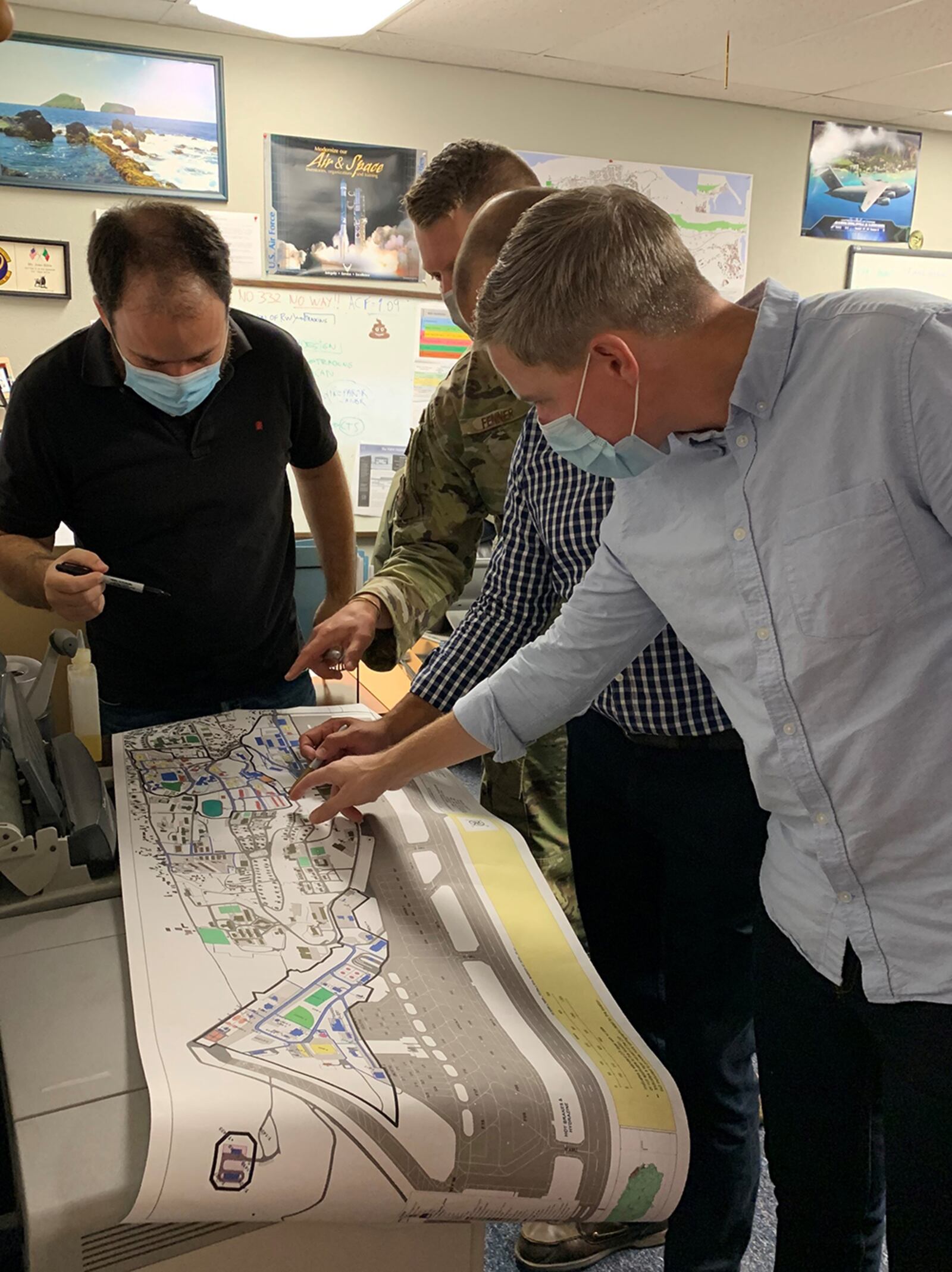 Instructors from the Air Force Institute of Technology’s Civil Engineer School assess the underground utility systems with engineers from the 65th Air Base Group as part of the CE School’s consultation to develop a base master plan at Lajes Field. U.S. AIR FORCE PHOTO/ CAPT. JORDEN CASTANEDA