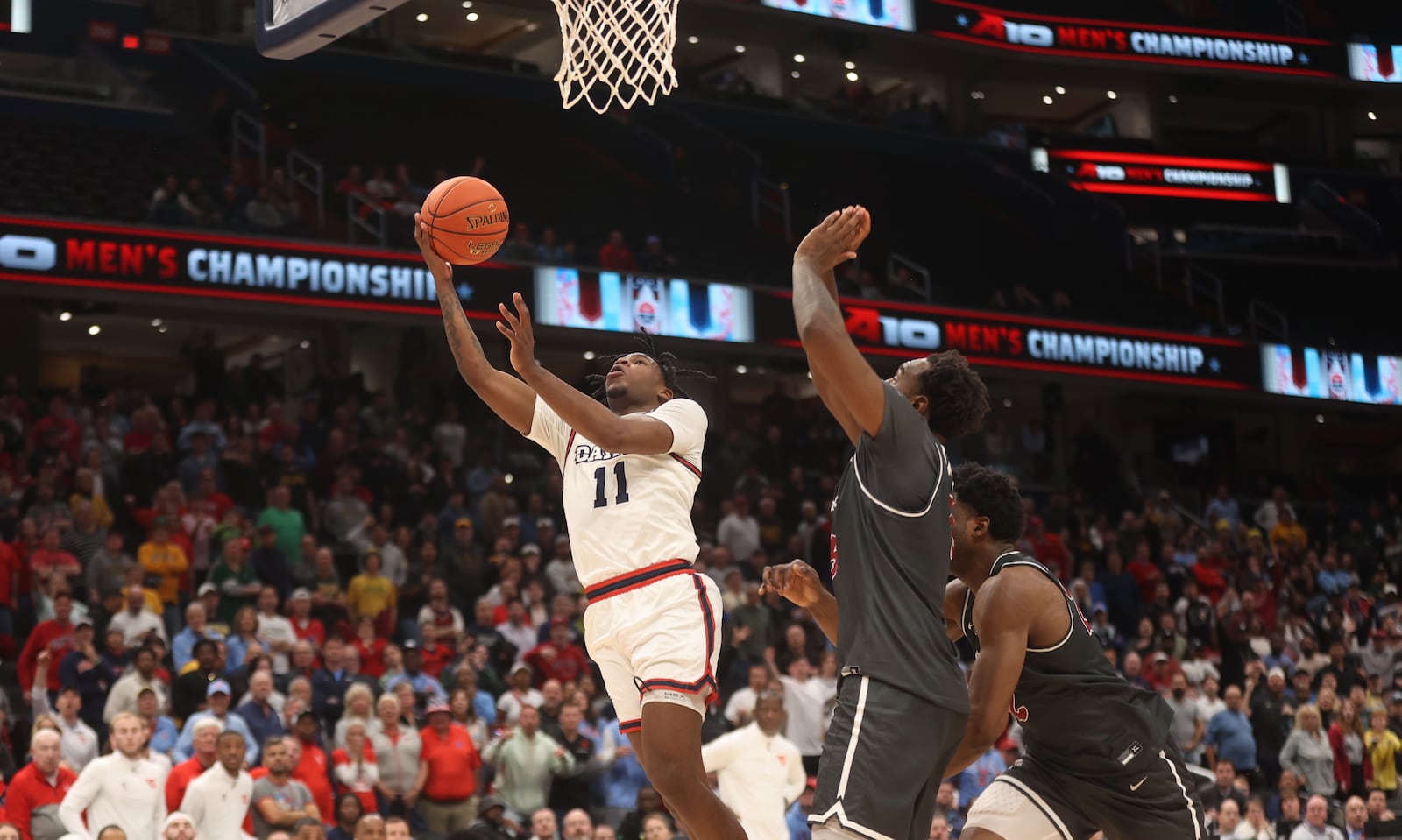 Dayton's Malachi Smith misses a shot in the final seconds of the second half against Saint Joseph’s on Friday, March 14, 2025, in the quarterfinals of the Atlantic 10 Conference tournament at Capital One Arena in Washington, D.C. David Jablonski/Staff