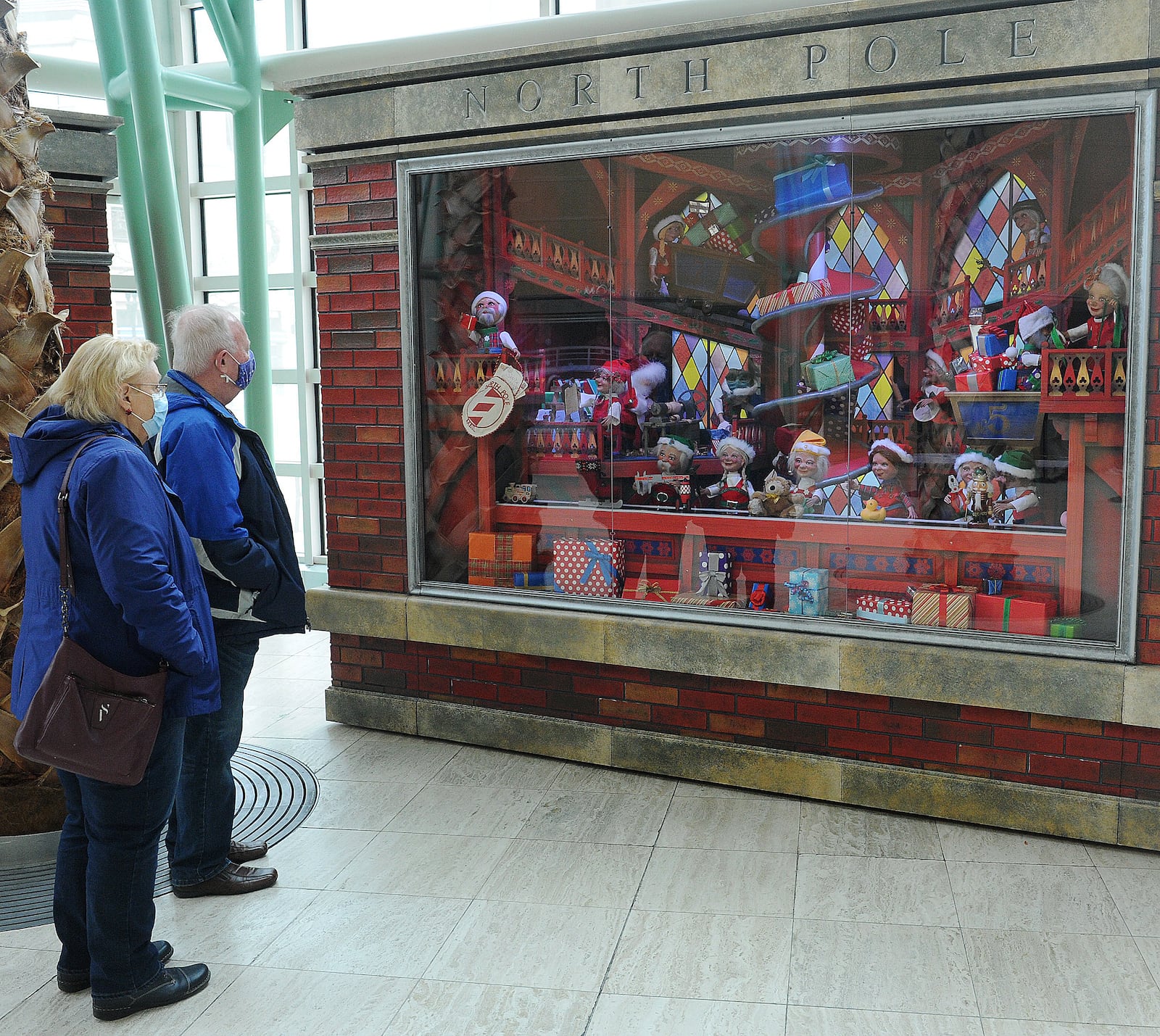 Sandra Ehrlich, left, with Tim Smith visited the Schuster Performing Arts Center Friday, Dec. 17, 2021 to check out the Rike's Holiday windows. The Rike's Holiday Windows have been on display since 1945. MARSHALL GORBY\STAFF