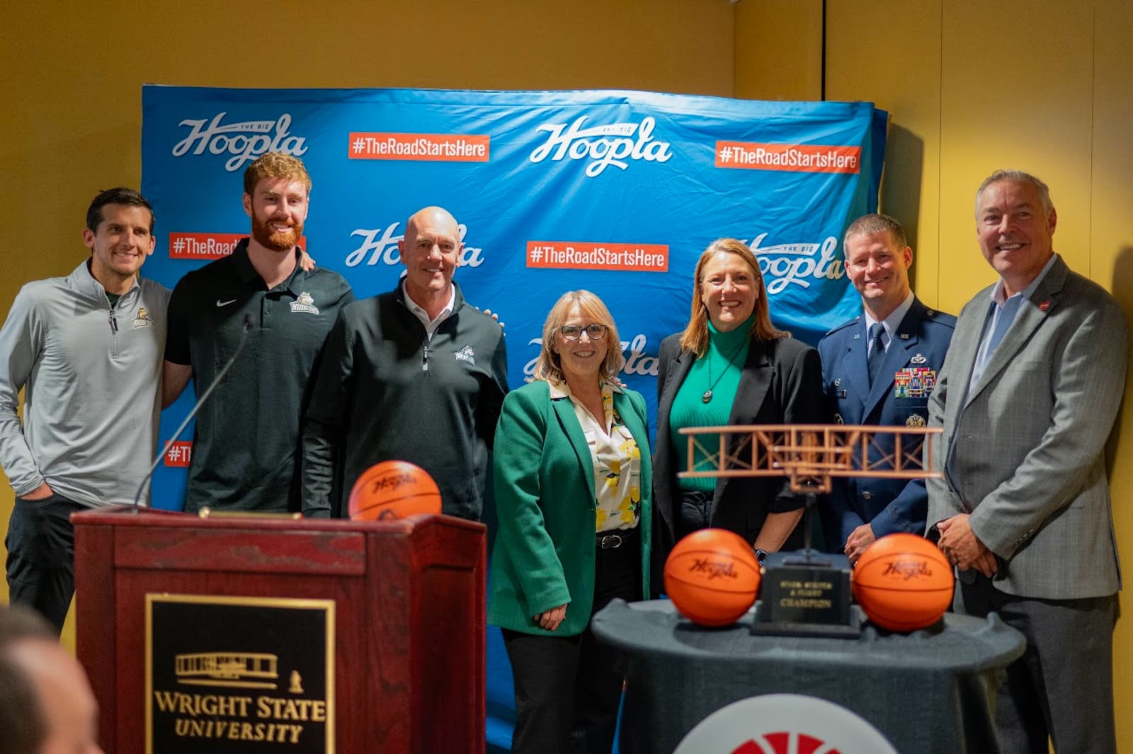 Wright State University and Wright-Patterson Air Force Base leaders gathered Tuesday to announce the launch of the Stars, Stripes and Flight Classic series. From left: WSU men's basketball Head Coach Clint Sargent, WSU senior Brandon Noel, WSU Chief Operating Officer Greg Sample, WSU President Sue Edwards, WSU Athletics Director Joylynn Brown, Col Dustin Richards (commander of the 88th Air Base Wing) and Scott Sullivan. a member of the JobsOhio Board of Directors.  CONTRIBUTED