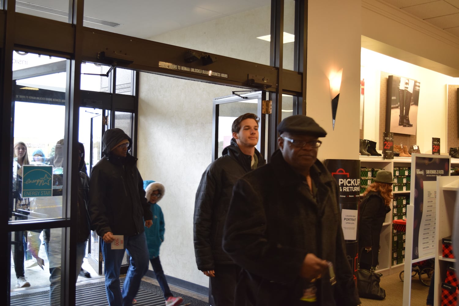 PHOTOS: Hundreds like up outside JCPenney for doorbusters, coupons