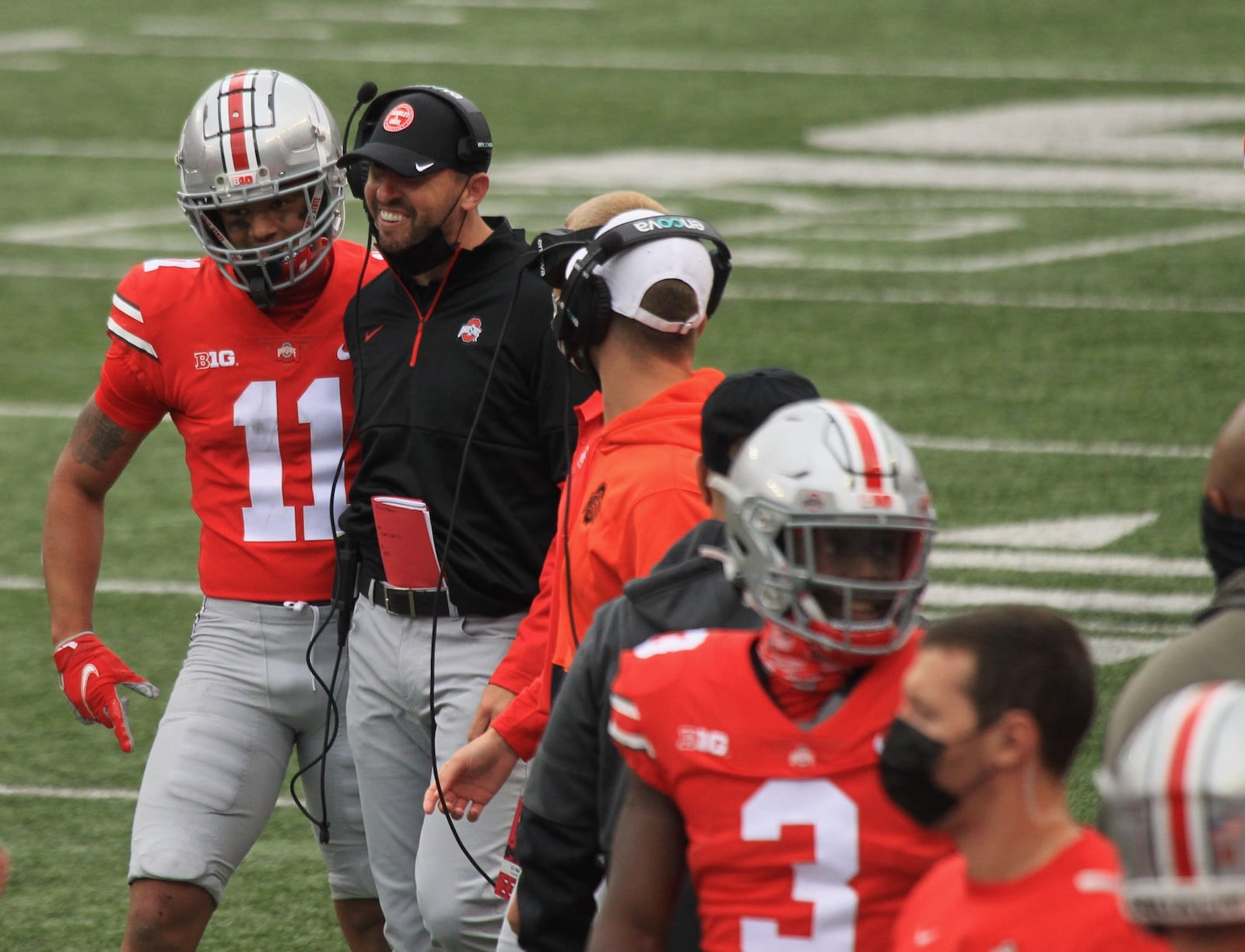 Ohio State wide receiver Jaxon Smith-Njigba celebrates a touchdown with coach Brian Hartline against Nebraska on Saturday, Oct. 24, 2020, at Ohio Stadium in Columbus. David Jablonski/Staff