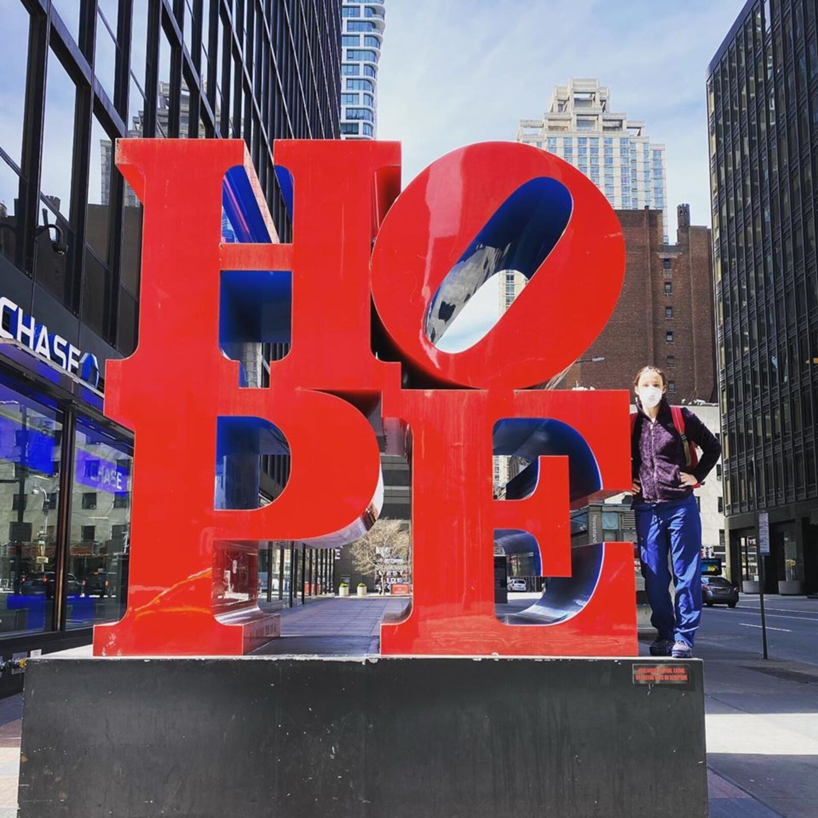 Clayton registered nurse Staci Hedke began a three week stint to help fight the coronavirus in New York.  Hedke is pictured at the New York HOPE art installation.