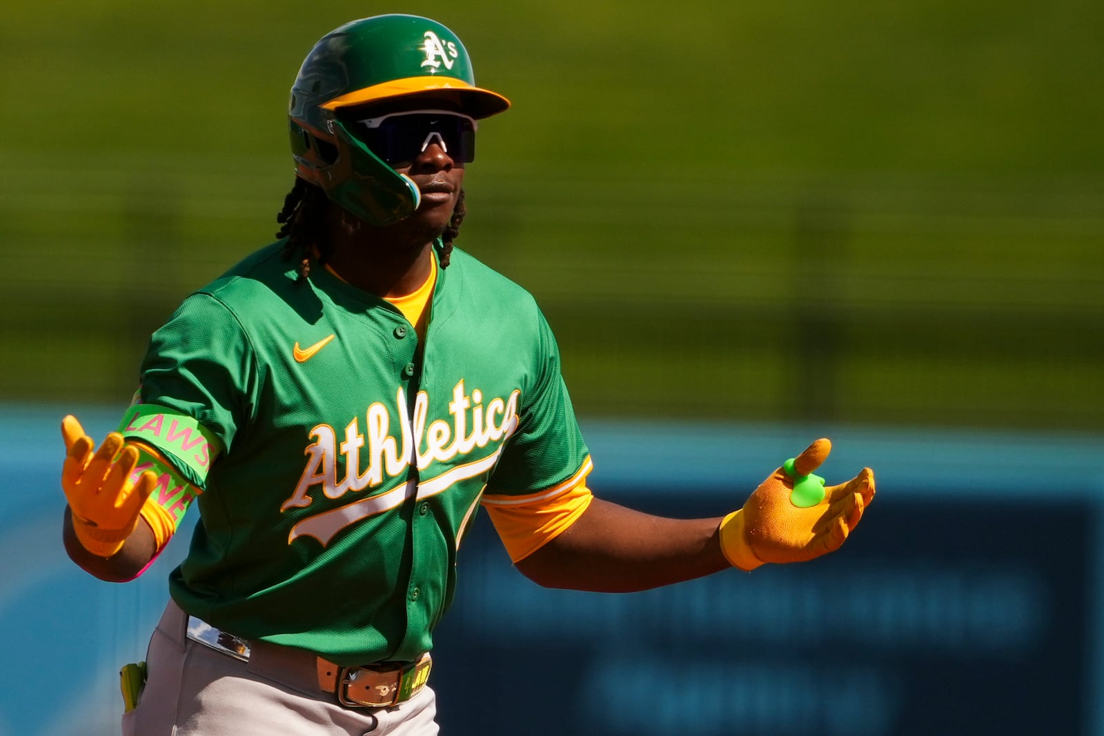 Athletics' Lawrence Butler reacts after hitting a single against the Kansas City Royals during the first inning of a spring training baseball game Monday, Feb. 24, 2025, in Surprise, Ariz. (AP Photo/Lindsey Wasson)