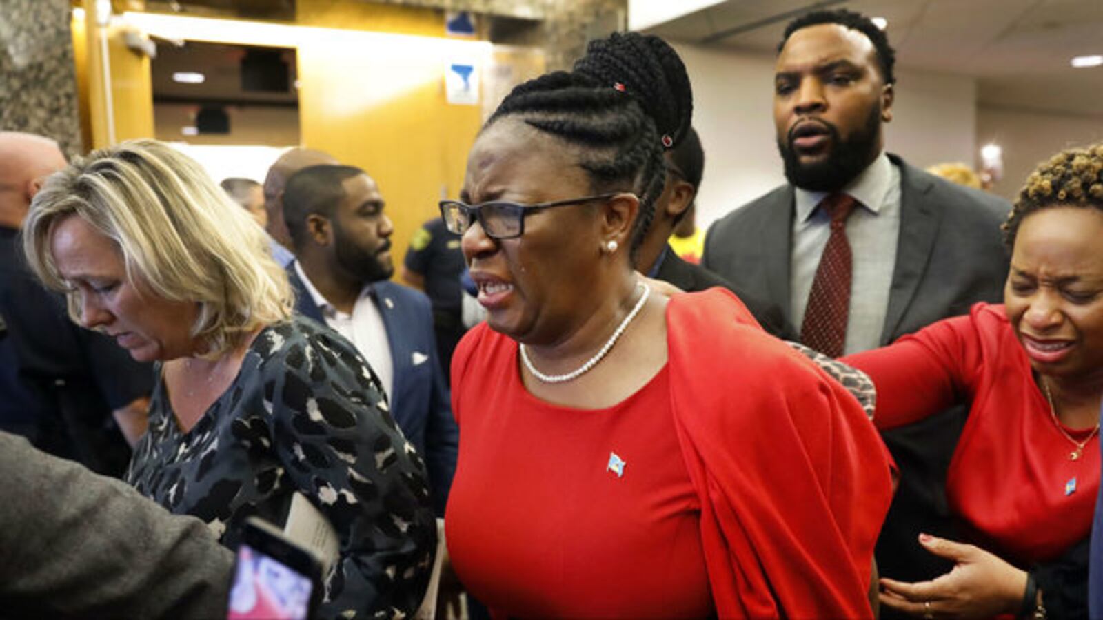 Allison Jean leaves court in Dallas on Tuesday, Oct. 1, 2019, after former police officer Amber Guyger's conviction for the 2018 murder of Jean's son, Botham Jean. Guyger shot Botham Jean, her neighbor, after going to his apartment by mistake.