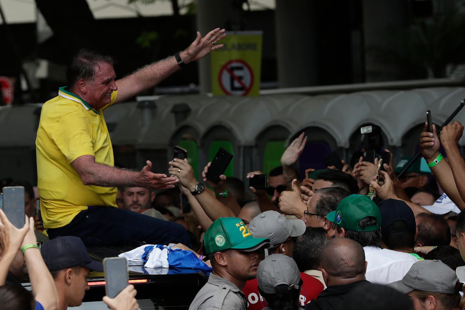 Brazil's former President Jair Bolsonaro greets supporters after a rally on Copacabana Beach in support of a proposed bill to grant amnesty to those arrested for storming government buildings in an alleged coup attempt in 2023, in Rio de Janeiro, Sunday, March 16, 2025. (AP Photo/Bruna Prado)