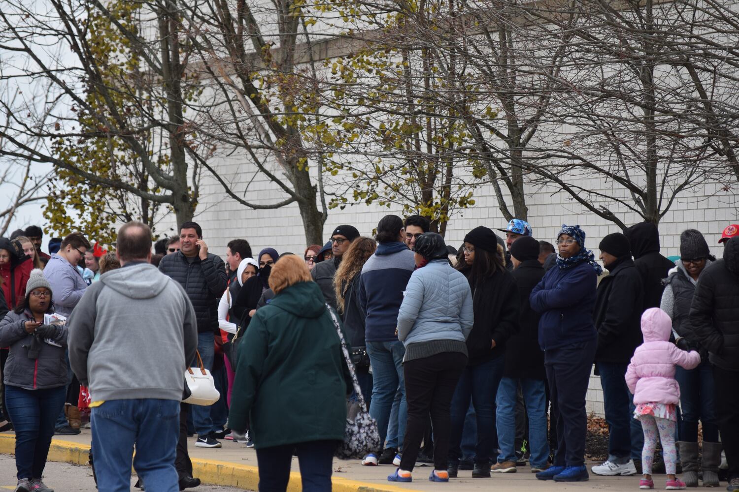 PHOTOS: Hundreds like up outside JCPenney for doorbusters, coupons