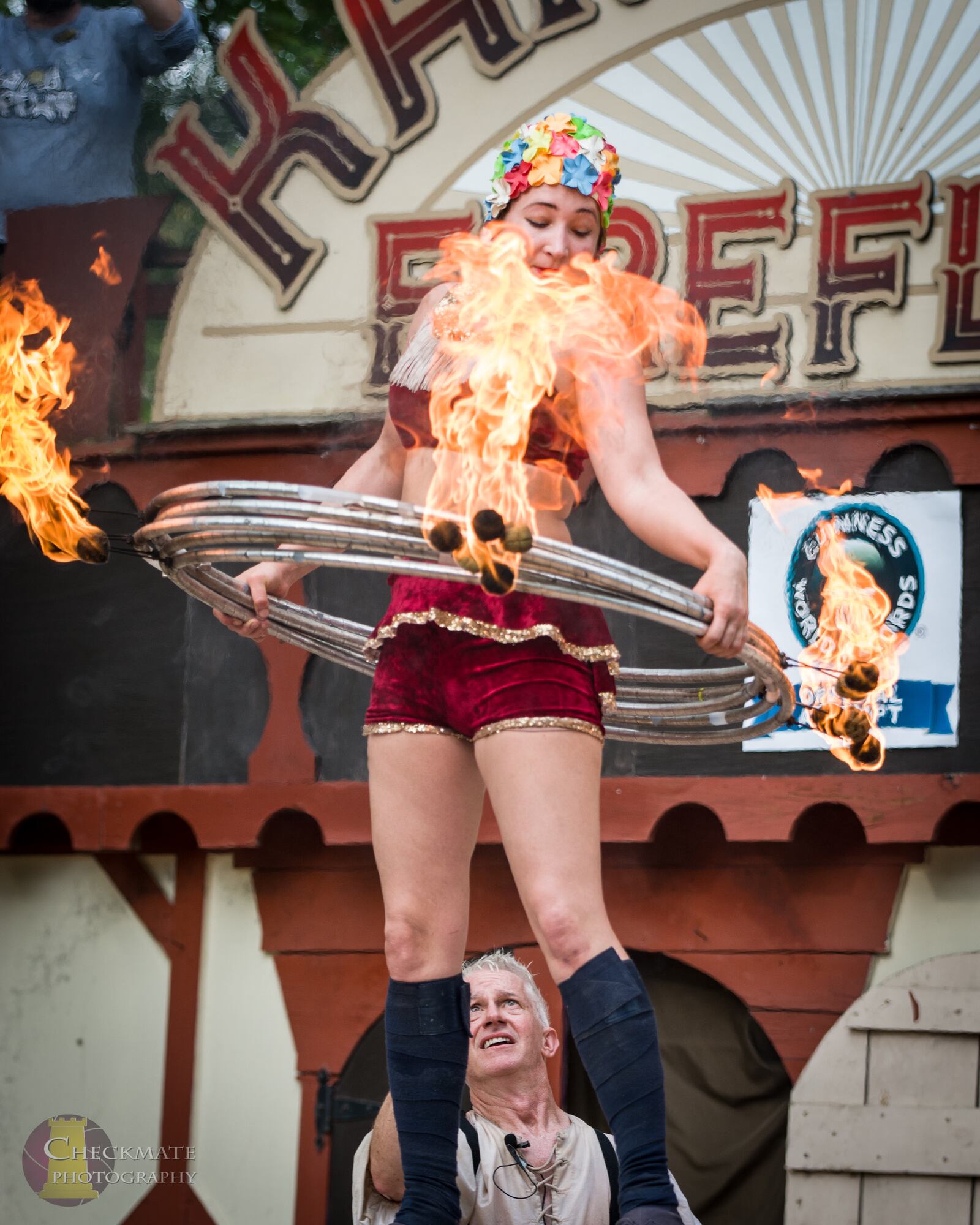 Casey Martin of the performing duo the KamiKaze FireFlies broke her own world Guinness World Record  for the most flaming hula hoops on the body at the Ohio Renaissance Festival near Waynesville Sunday, Sept. 29.