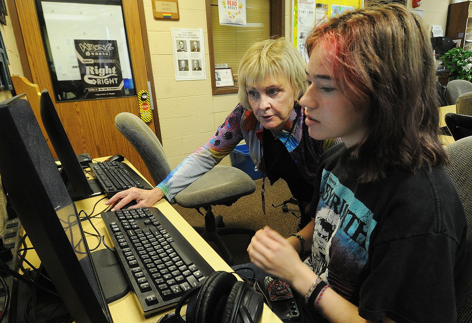 Centerville High School teacher Tricia Rapoch works with student Lindy Collings at the school's radio station Thursday Sept. 22, 2022. MARSHALL GORBY\STAFF