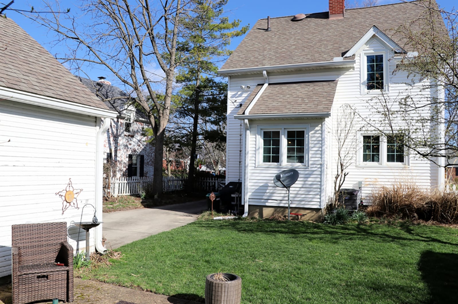 The property has a fenced back yard with a picket fence that crosses the long concrete driveway that ends at the detached, 2-car garage. The back yard has a paver-brick patio and has flowering bushes across the back for added privacy. CONTRIBUTED PHOTO BY KATHY TYLER