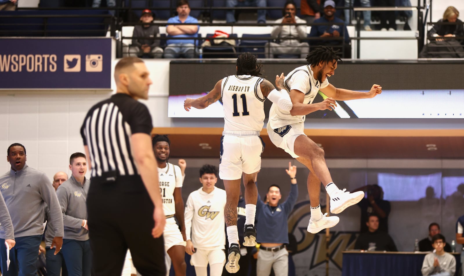 George Washington celebrates a victory against Dayton on Saturday, Jan. 21, 2023, at the Charles E. Smith Center in Washington, D.C. David Jablonski/Staff