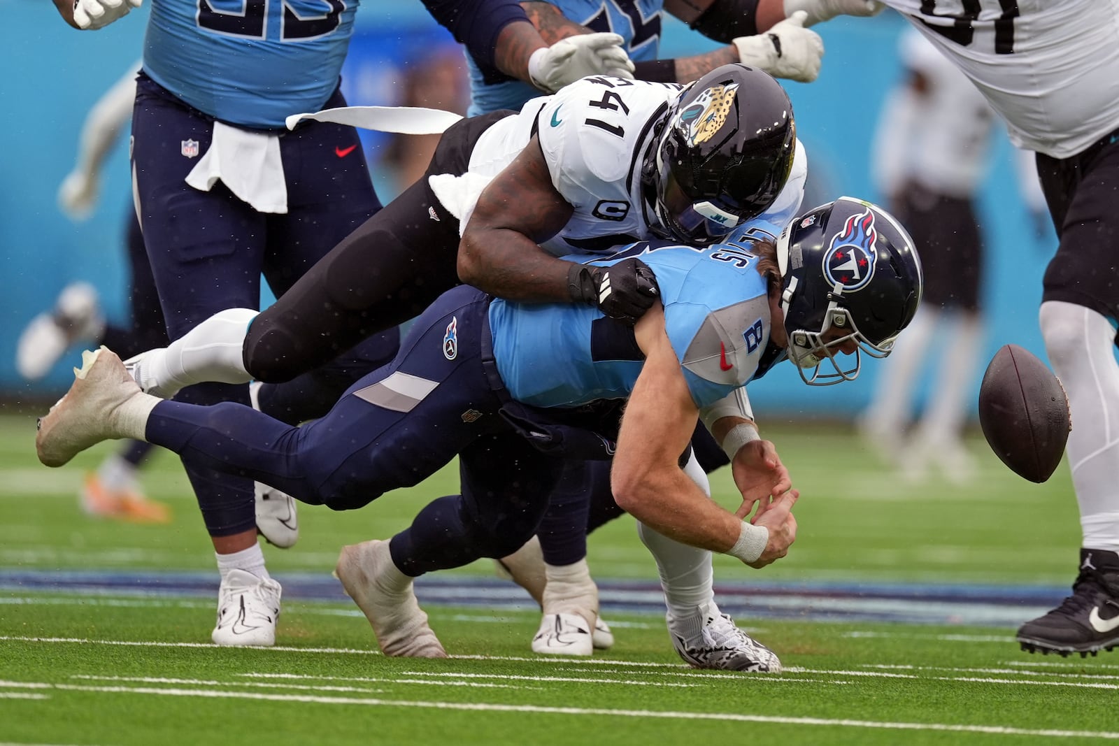 Jacksonville Jaguars defensive end Josh Hines-Allen (41) sacks Tennessee Titans quarterback Will Levis causing a fumble during the first half of an NFL football game, Sunday, Dec. 8, 2024, in Nashville, Tenn. (AP Photo/George Walter IV)