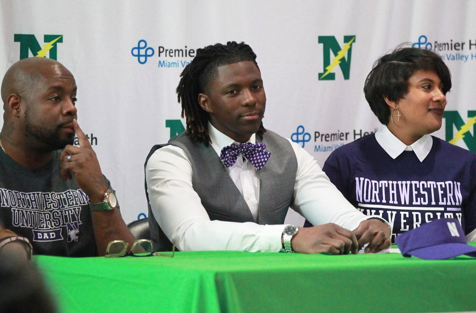 Northmont senior Jaiden Cameron is joined by his parents during a signing ceremony to play football at Northwestern University on Wednesday, Dec. 18, 2019. MARC PENDLETON / STAFF