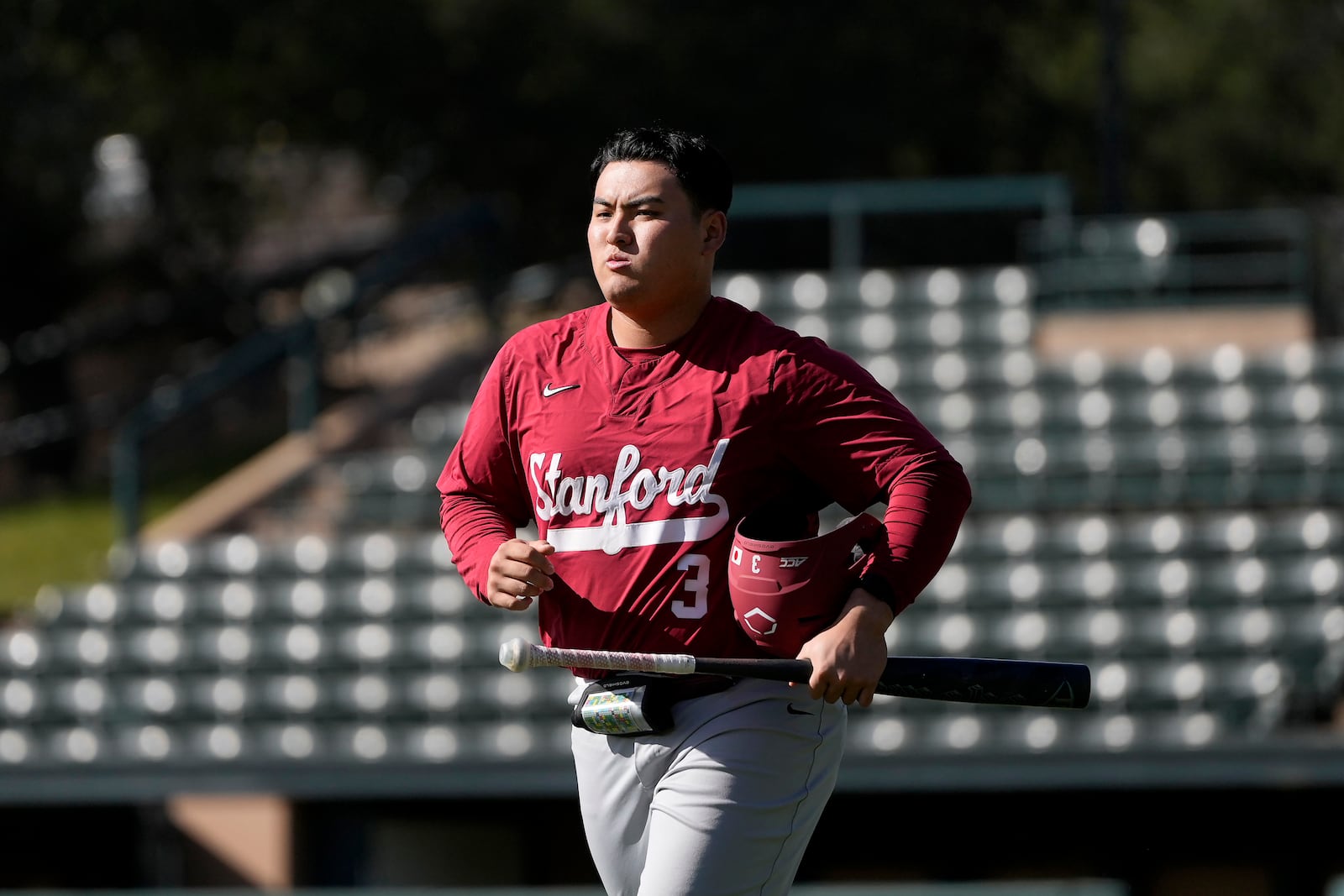 Stanford baseball player Rintaro Sasaki jogs toward the batting cage area at the Sunken Diamond baseball field at Stanford University in Stanford, Calif., Friday, Feb. 7, 2025. (AP Photo/Jeff Chiu)