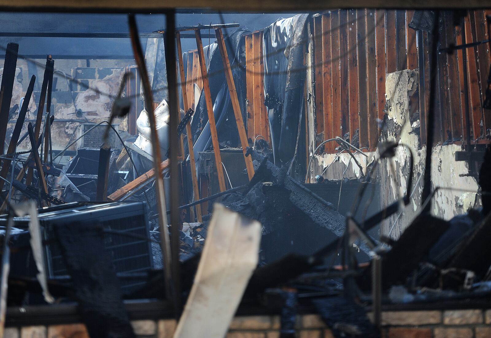 Two businesses suffered heavy fire damage in the 900 block of Patterson Road Thursday morning, March 14, 2024. The cause of the fire remains under investigation. MARSHALL GORBY\STAFF