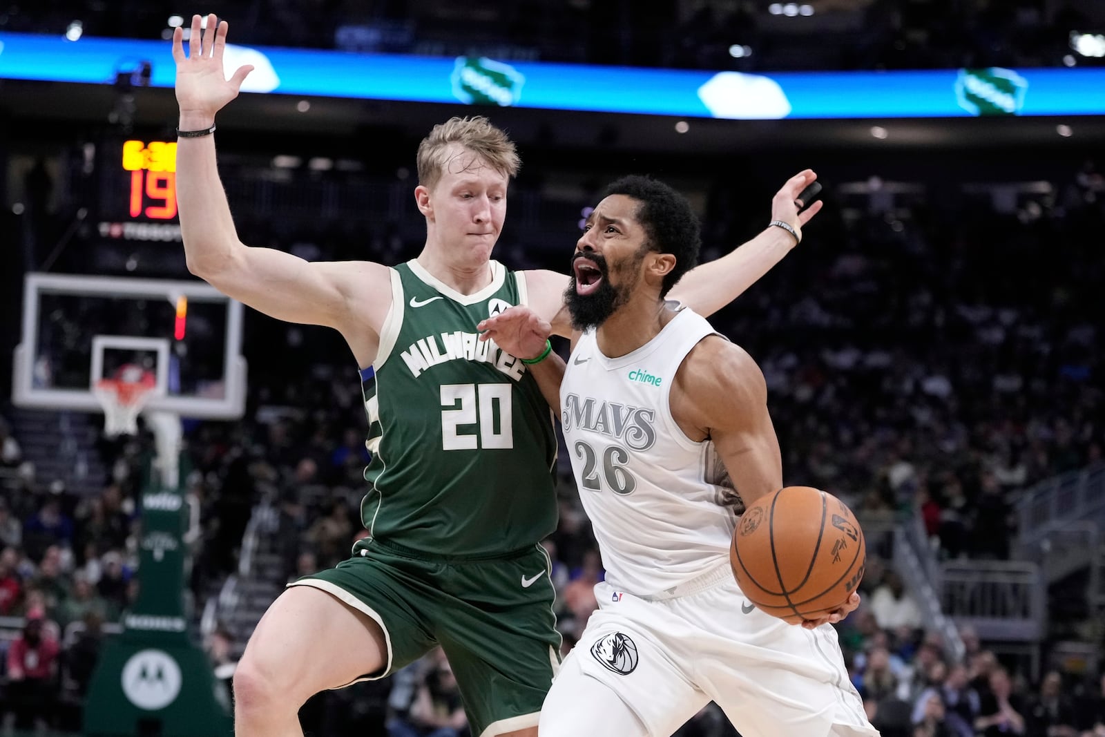 Dallas Mavericks' Spencer Dinwiddie tries to get [ast Milwaukee Bucks' AJ Green during the first half of an NBA basketball game Wednesday, March 5, 2025, in Milwaukee. (AP Photo/Morry Gash)