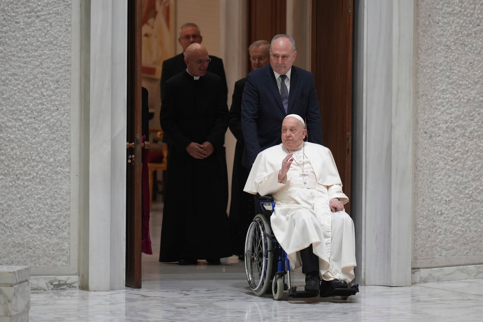 FILE - Pope Francis arrives for his weekly general audience in the Paul VI Hall, at the Vatican, Wednesday, Feb. 12, 2025. (AP Photo/Alessandra Tarantino, File)