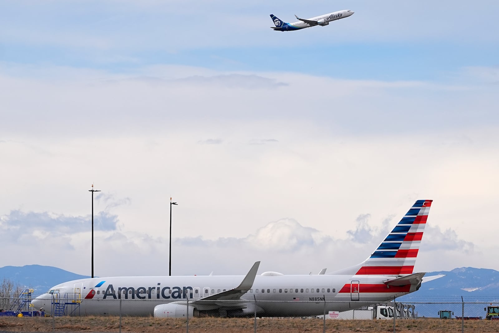 An American Airlines jetliner that caught fire after landing Thursday at Denver International Airport sits near a hangar at the airport Friday, March 14, 2025, in Denver. (AP Photo/David Zalubowski)