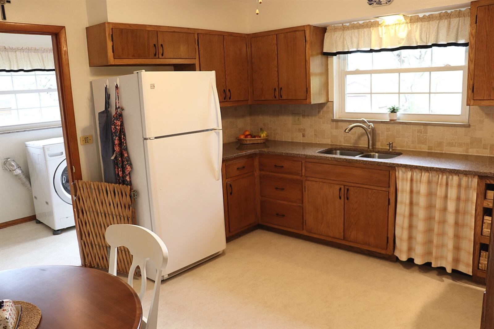 In the kitchen, granite counters offer plenty of preparation space. 